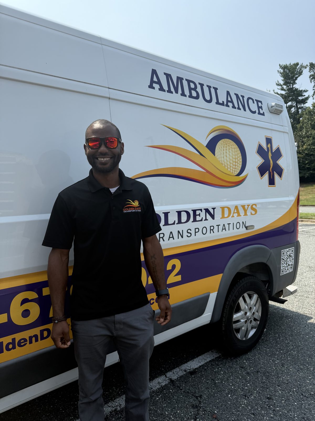 A Golden Days driver standing in front of the Golden Days wheelchair-accessible van